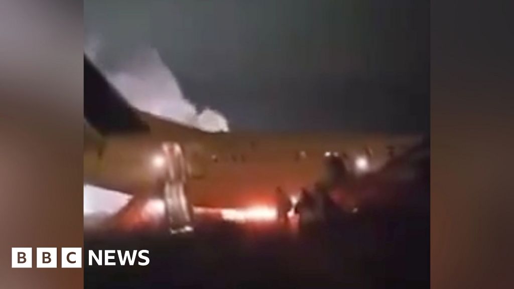 Passengers flee burning plane that skidded off runway