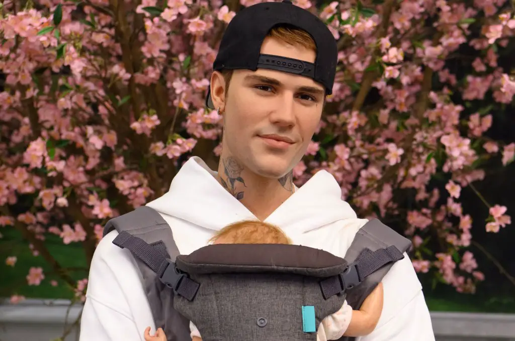 Justin Bieber’s Wax Figure Wears a Baby Carrier at Madame Tussauds