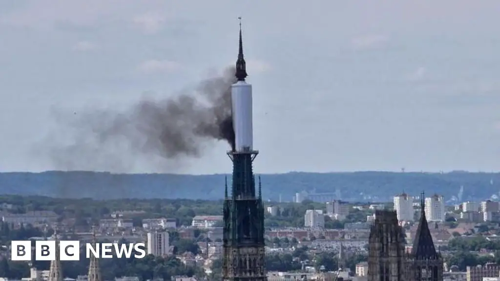 Rouen cathedral spire on fire with building evacuated