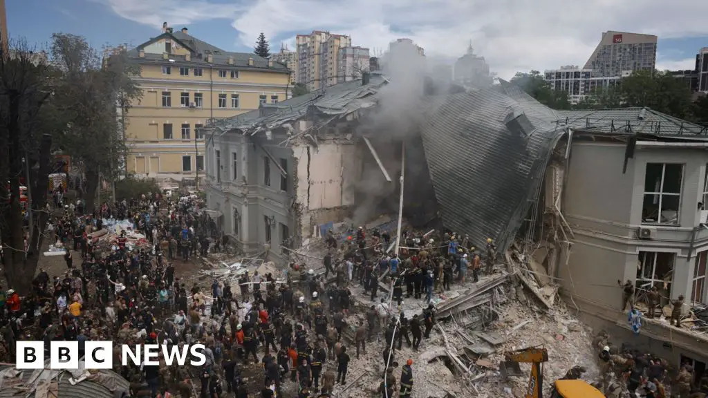 Staff help clear rubble from destroyed Kyiv hospital